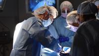 Surgeons working on a patient in an OR.